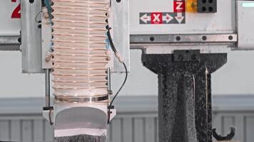 Dust extraction system for use in conjunction with a woodworking machine, specifically designed to remove dust and wood shavings during the manufacturing process. Medium shot. Slow motion. video