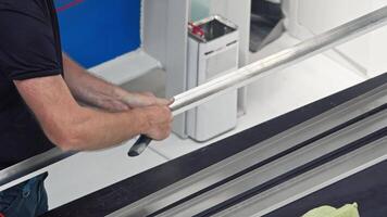 Process of manually adjusting a metal product by a skilled factory worker. Slow motion. Close up. video