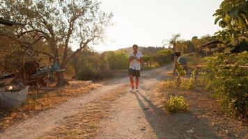 Man Walking On A Country Path Reading A Book video