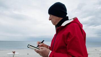 Man Trying To Draw The Surrounding On Paper video