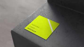 mockup of square card on cracked concrete step seen from above with blurred background psd