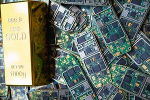 pile of electronic waste on factory floor is circuit board of mobile phone waiting to be processed extract gold to separate precious metal from electronic waste. extracting precious metal from e-waste photo