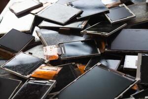damaged LCD screens of mobile phones are collected as electronic waste waiting for valuable metals inside LCD screens be sorted for reuse reducing e-waste in nature and increasing value of e-waste. photo