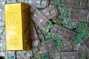 pile of electronic waste on factory floor is circuit board of mobile phone waiting to be processed extract gold to separate precious metal from electronic waste. extracting precious metal from e-waste photo