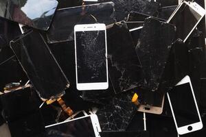 damaged LCD screens of mobile phones are collected as electronic waste waiting for valuable metals inside LCD screens be sorted for reuse reducing e-waste in nature and increasing value of e-waste. photo