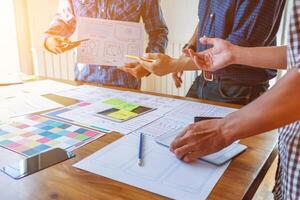 Smooth Focus, group of web designers are working together to develop mobile responsive website with UI UX Front End Designer Previewing. website designers in form of mobile applications with UI UX photo