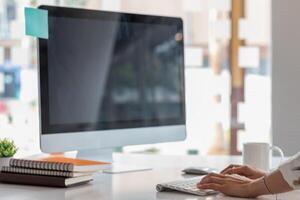 A businesswoman is using a laptop to communicate and check work from home online because she is starting a business that can order and check from anywhere online.online business ideas photo