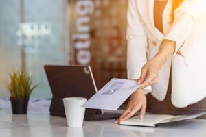 businesswoman is using a smartphone to communicate and check work from home online because she is starting a business that can order and check from anywhere online.online business ideas photo