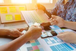 Smooth Focus, group of web designers are working together to develop mobile responsive website with UI UX Front End Designer Previewing. website designers in form of mobile applications with UI UX photo