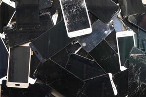 damaged LCD screens of mobile phones are collected as electronic waste waiting for valuable metals inside LCD screens be sorted for reuse reducing e-waste in nature and increasing value of e-waste. photo