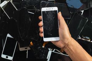 damaged LCD screens of mobile phones are collected as electronic waste waiting for valuable metals inside LCD screens be sorted for reuse reducing e-waste in nature and increasing value of e-waste. photo
