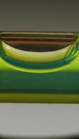 Leveling instrument's bubble closeup. Carpenter's spirit level macro. Buildings and construction level video