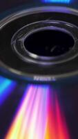 Background of compact disks or dvds. Glare of light on the disk DVD , beautiful colored glare from the light, the background disk DVD video