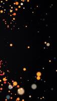 Transition of hot explosive particles. Abstract animation of flying particles from one source. Glowing glare in focus on black background video