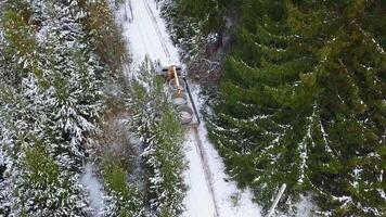 Daytime landscape. Clip.A view from a height of a moving truck on a forest highway with a load in the back. video
