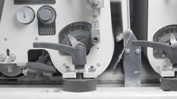 Close-up of conveyor machine with pressure indicator. Creative. Moving conveyor line with pressure. Production of rubber on conveyor machine video
