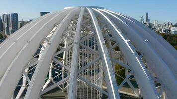 Top view of white domed structure. Stock footage. Beautiful modern building in city center in summer. Architecture of modern circus dome made of white metal arches video