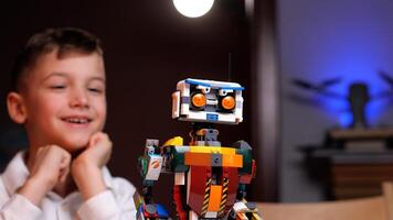 Child playing with programmable ai robot toy at home photo