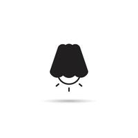 A black and white icon of a lamp with a light bulb vector