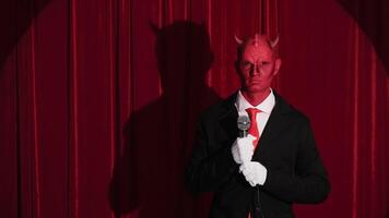 Devilish comedian performing stand up routine on stage video