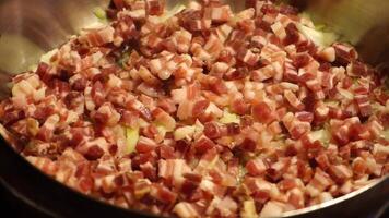 Preparation of the sauce with onion, pancetta, pork rind and finally tomato puree video