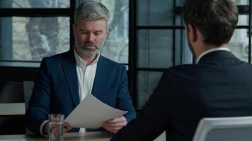 Man client insurance agent signing business contract make agreement hiring hire job two Caucasian men businessmen in negotiation meeting partners sign finance deal paper document teamwork interview video