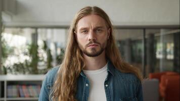 Portrait serious sad upset frustrated stressed tired frown Caucasian man guy student male in high school library university academy looking at camera alone studying education problem learning trouble video