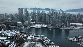 Aerial time-lapse of the Downtown of Vancouver covered with snow in winter video