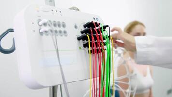 Close-up of a doctor handling EEG sensors, highlighting precision and care in advanced diagnostic procedures. Ideal for showcasing modern medical technology and professional expertise. video