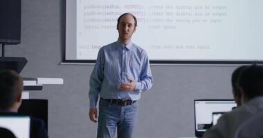 Professional Teacher Teaching Young School Students Of Programming, Coding And Computer Science video