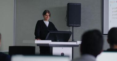Teen Boy Student Standing On Podium In Classroom And Talking With Classmates, Programming Classes video