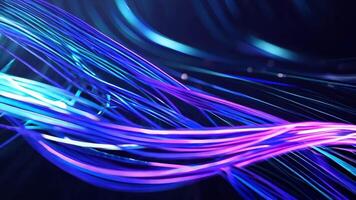Vibrant abstract waves of light in blue and purple tones, creating an energetic and dynamic visual effect on a dark background. video