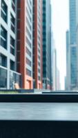 Empty Black Marble Counter Top With Blurred Modern Building Background photo