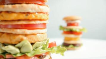 Closeup of a giant burger with lettuce and tomato photo