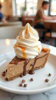 Closeup of a slice of chocolate pie with whipped cream and caramel sauce on a white plate photo