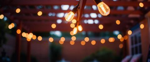 Warm String Lights Hanging Over Bokeh Background photo