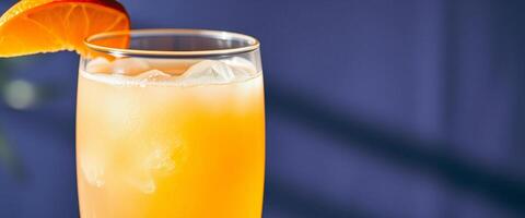 Close-up of a refreshing orange drink with ice photo