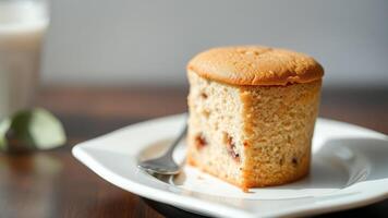 Close-up of a single muffin on a white plate photo