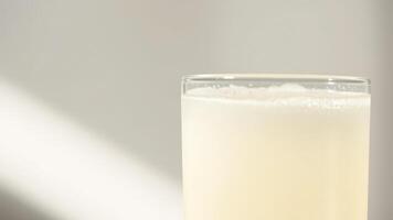 Closeup of a Glass of Sparkling Water with a White Background photo
