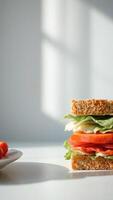 Closeup of a Sandwich with Tomato and Lettuce on a White Background photo