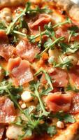 Closeup of Delicious Pizza with Ham, Arugula, and Mozzarella photo