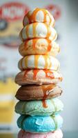 Stack of colorful donuts with caramel topping photo