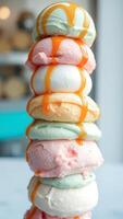 Stack of colorful ice cream scoops with caramel sauce photo