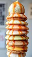 Stack of Colorful Cookies Drizzled with Caramel Sauce photo