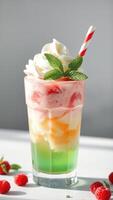 Refreshing Layered Dessert Drink with Whipped Cream and Mint photo