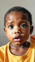 Portrait of a young boy with a curious expression photo