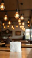 Sugar Cube on Wooden Table in a Cafe photo