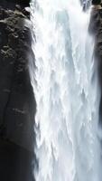 Closeup of a Waterfall Rushing Down a Cliff photo