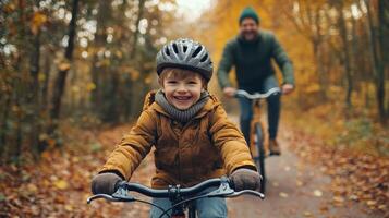 Joyful Father and Son Bike Ride Through Autumn Forest photo