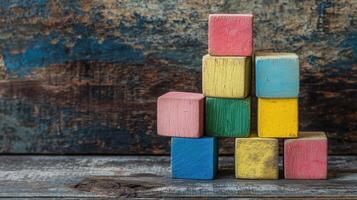 Colorful Wooden Blocks Stacked Creatively on Wooden Surface photo